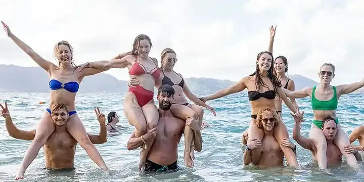 Shoulder rides in the sea with arms out wide on the SYB Philippines trip