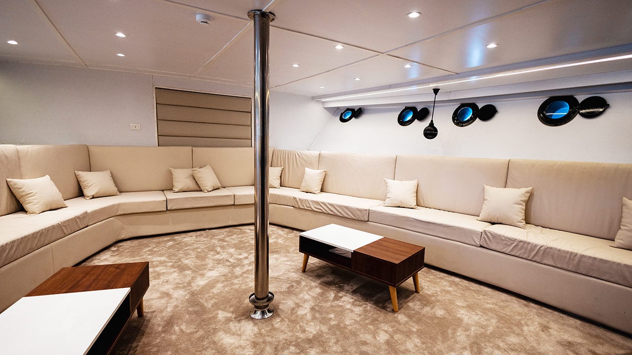 The indoor saloon with long sofas