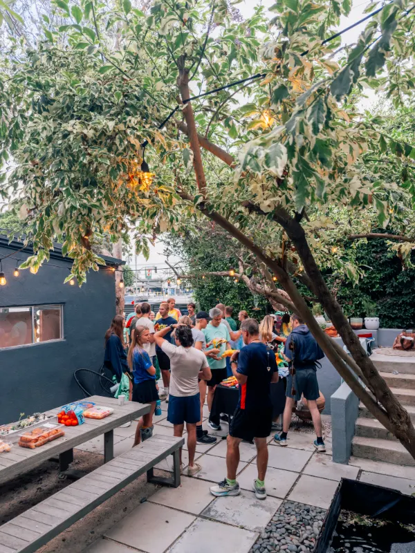 Runners gathering in the Milwood Studios courtyard before the 5K