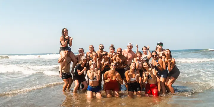 The whole SYB crew standing in the surf on the SYB Nicaragua trip