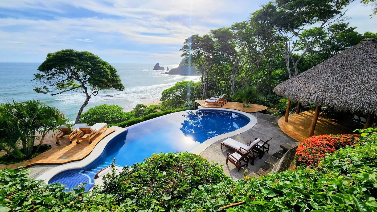A villa pool in the jungle above the bay