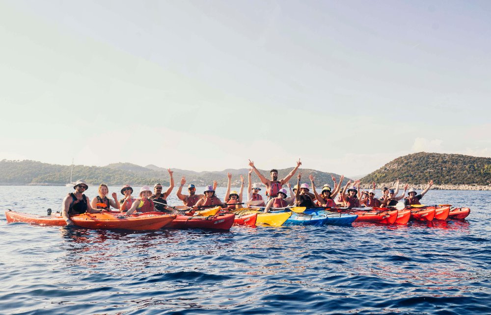 SurfYogaBeer group kayaking together off Dubrovnik, Croatia