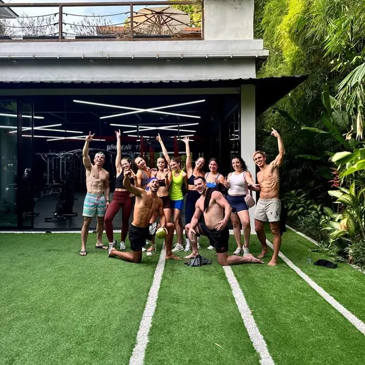 The crew cheering on the turf outside the gym on the SYB Bali trip