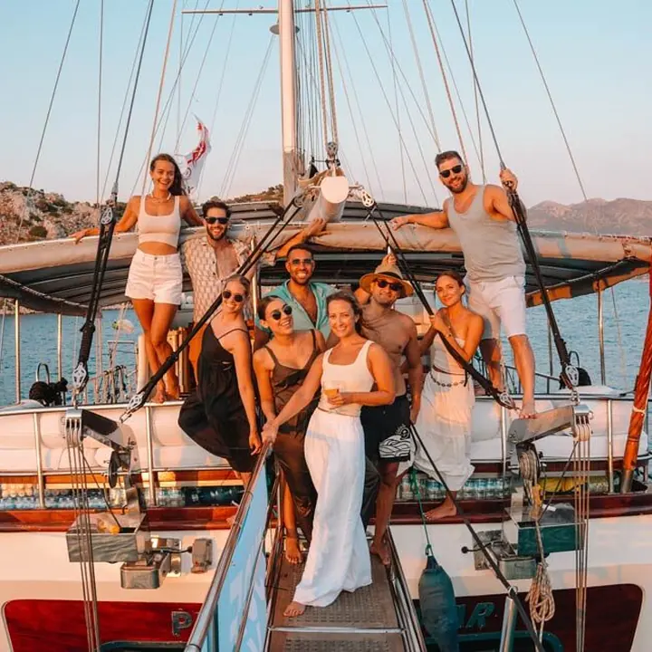 SYB crew dressed up on the bow of the gulet at sunset on the SYB Turkey trip
