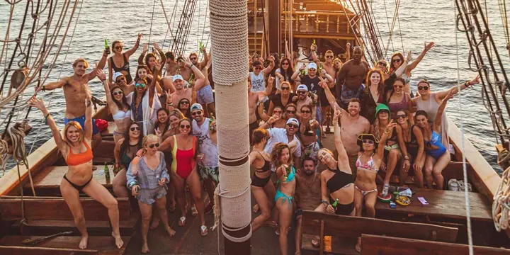 The whole crew cheering on the deck of the wooden ship on the SYB Croatia trip