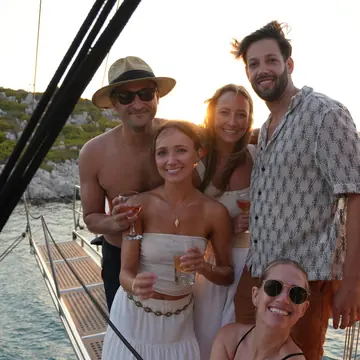 Five friends dressed up on deck at sunset on the SYB Turkey trip