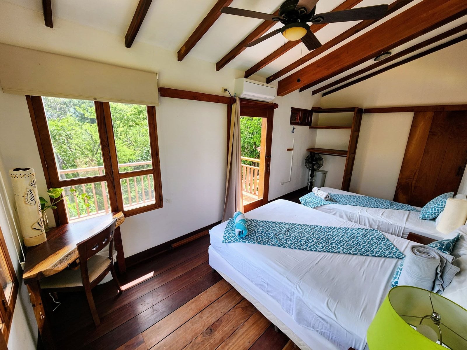 A bedroom with two single beds