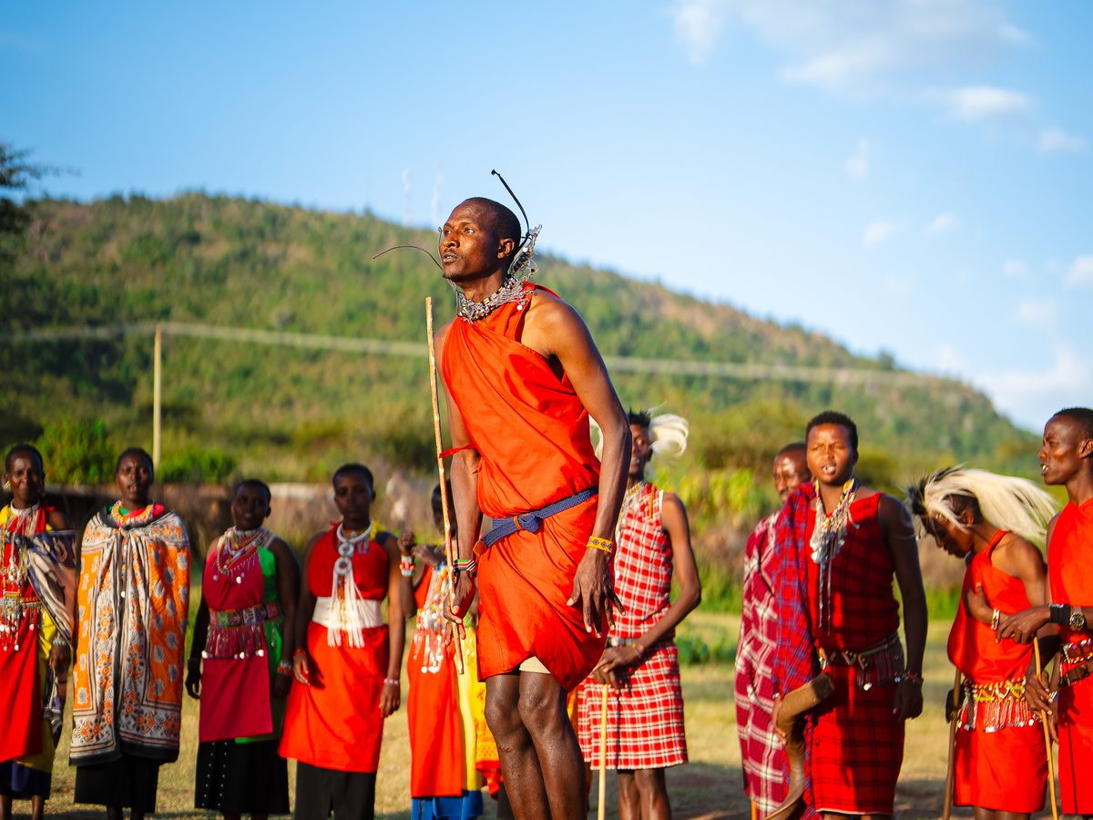 SurfYogaBeer guests visiting a Masai village in Kenya