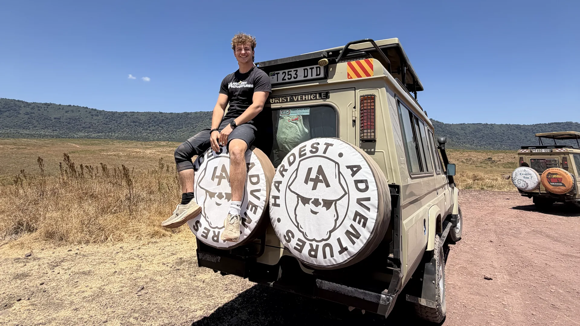 Safari jeep overlooking the Ngorongoro crater on the Hardest Adventures Kilimanjaro extension trip to safari and Zanzibar.