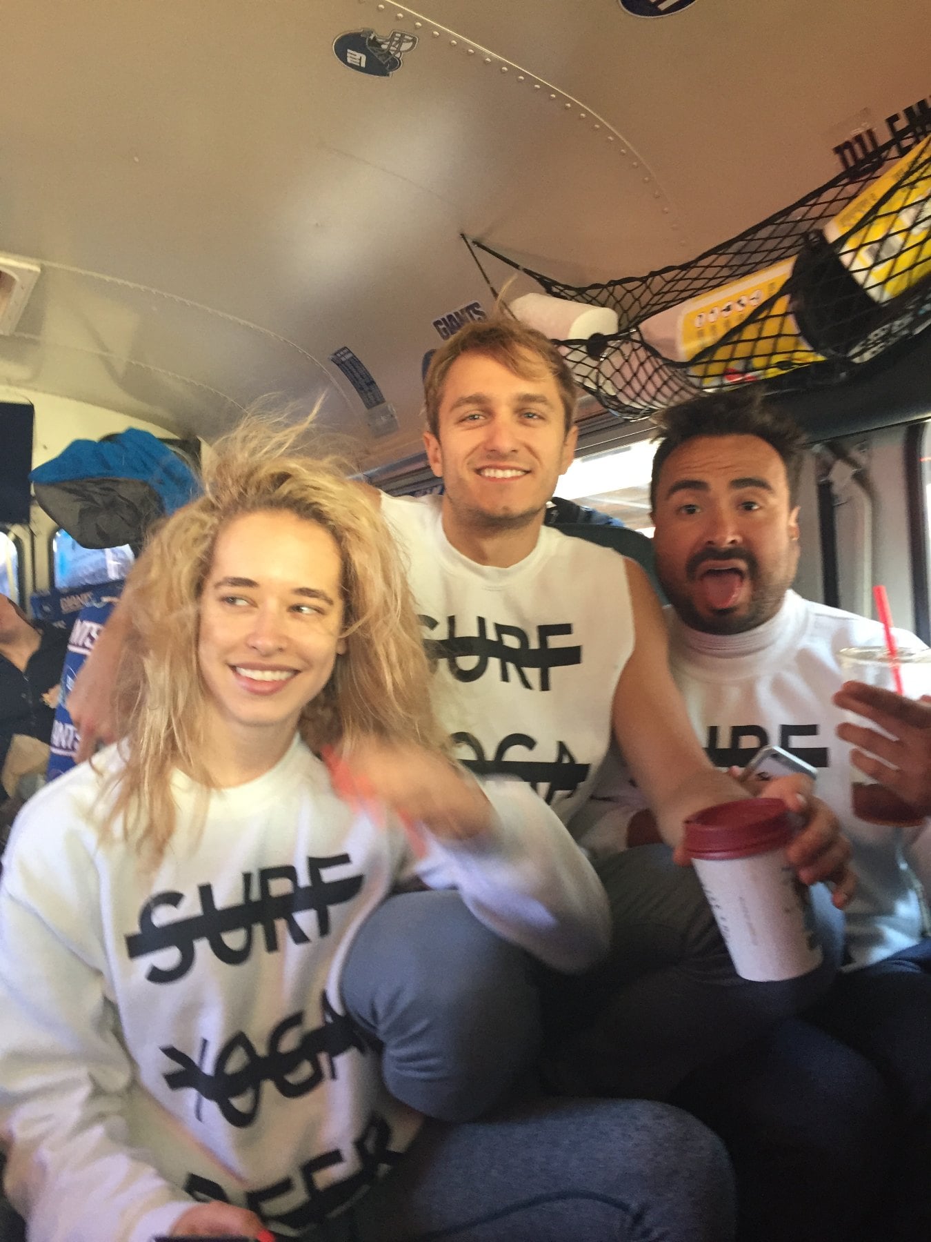 SYB crew on the bus to Vermont in white cross-out tops
