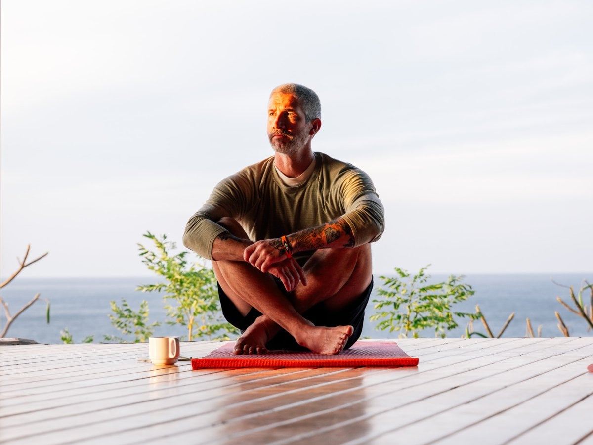 Morning meditation on the open deck above the surf