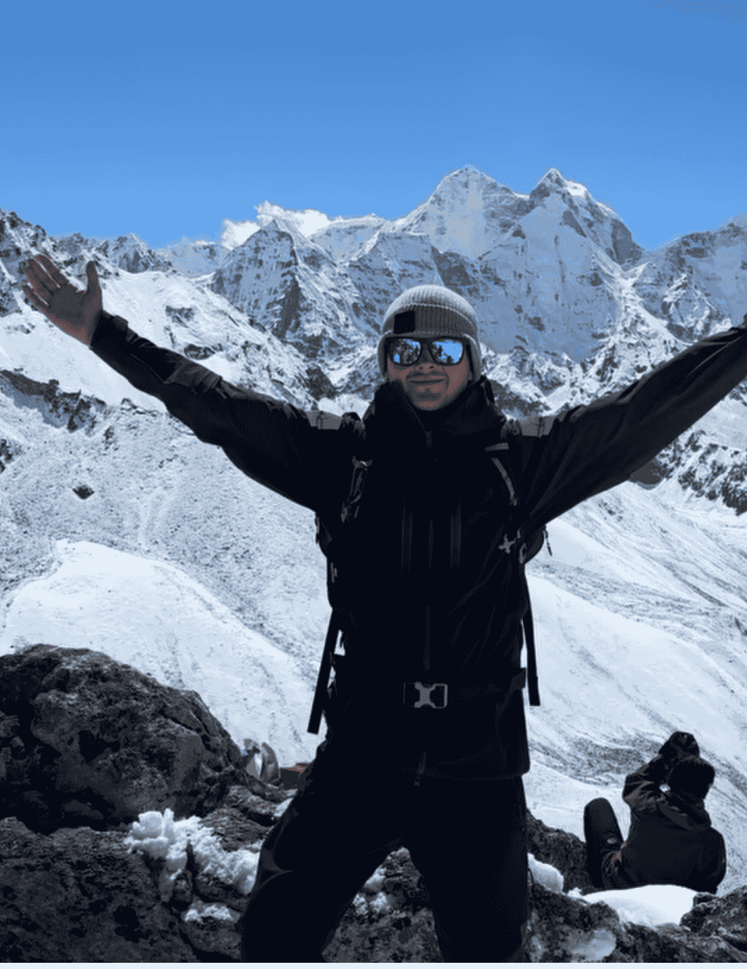 Group of hikers celebrating summit atop Kilimanjaro after completing their trek with Hardest Adventures.