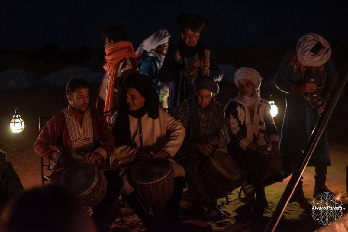 Drums around the fire at night at Sahara Desert Luxury Camp