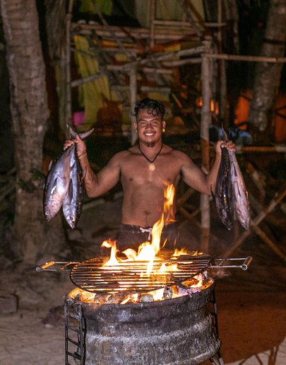 Fire show performer on a secluded beach in Palawan