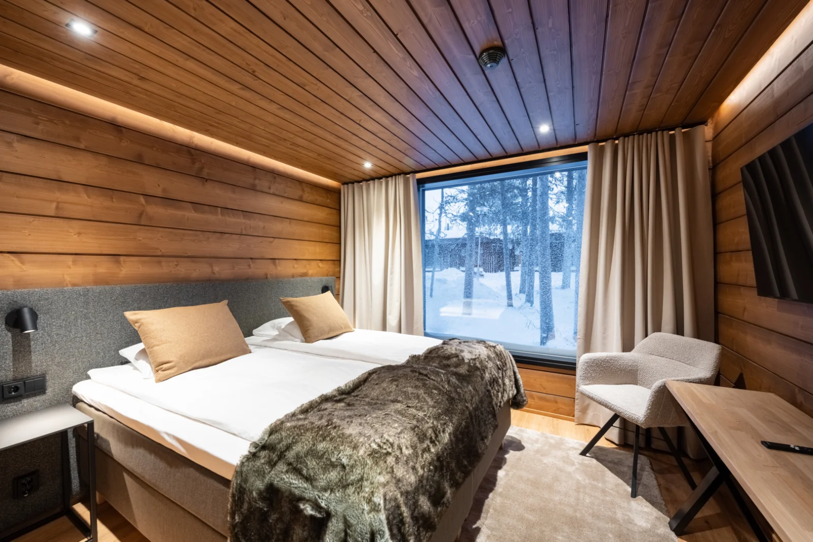A wood lined twin Wilderness Room