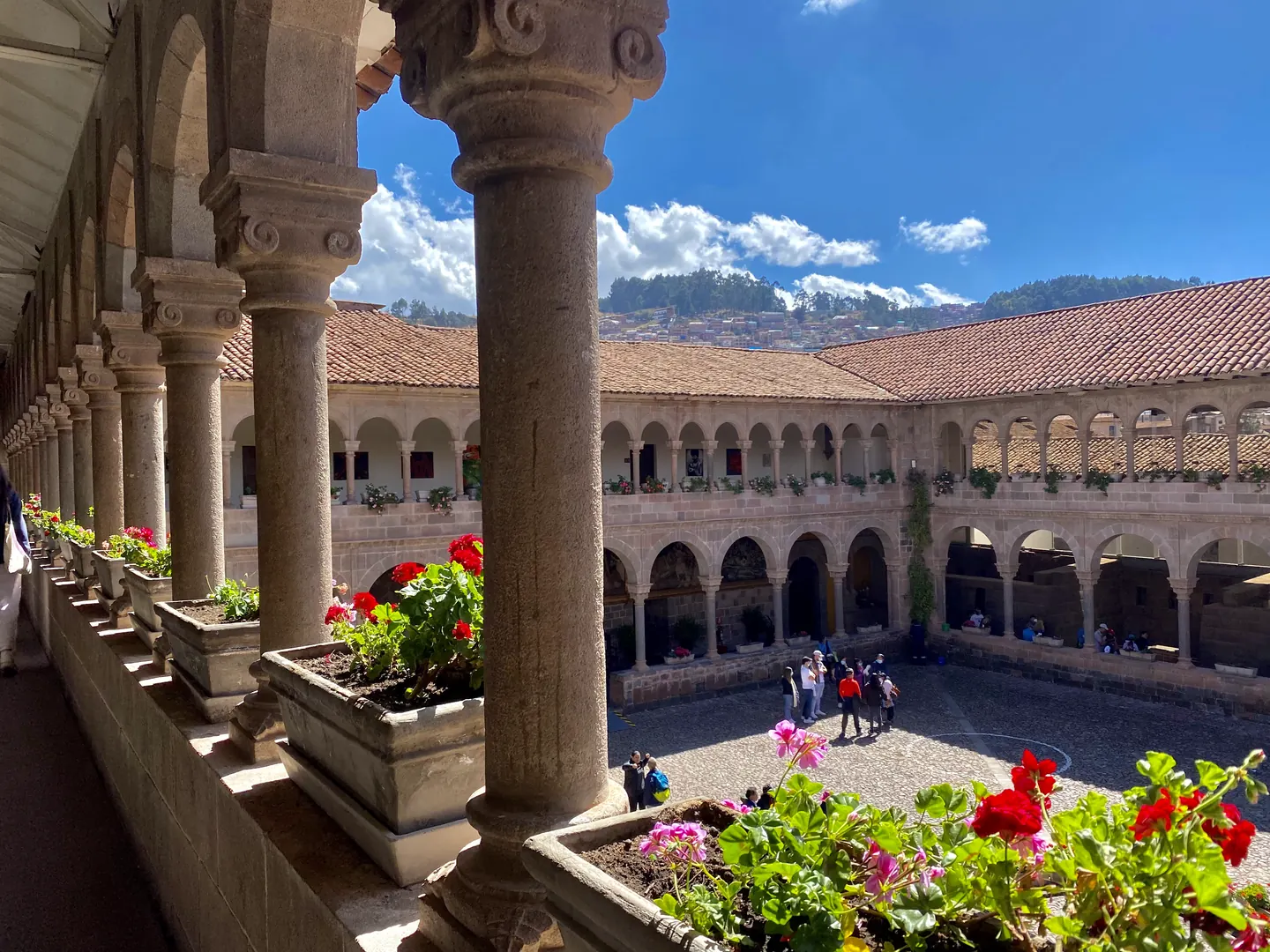 Hardest Adventures trekkers exploring a colonial cloister courtyard in Cusco before the Salkantay trek to Machu Picchu.