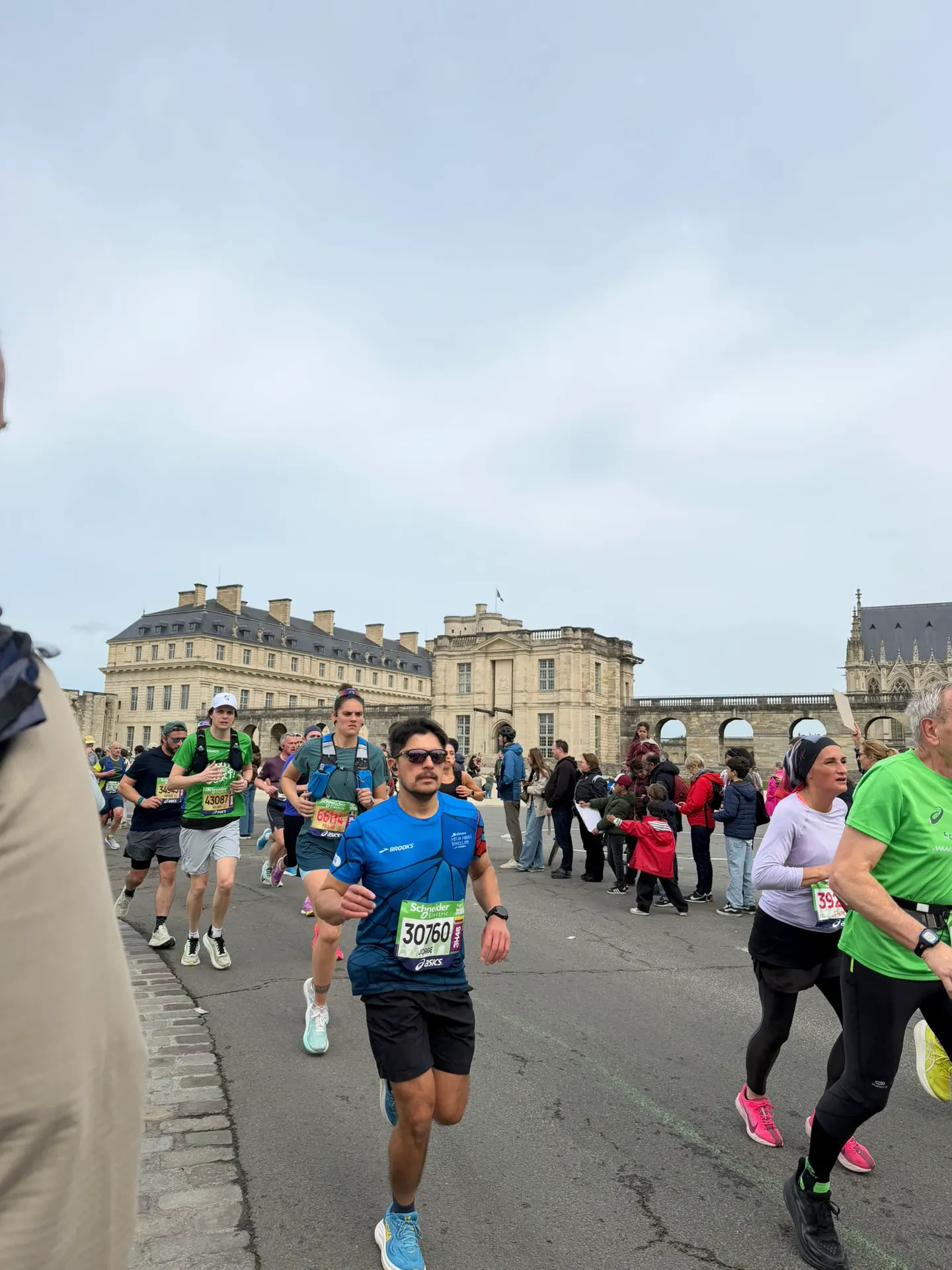 Runner making their way through the Bois de Vincennes during the Paris Marathon with Hardest Adventures.