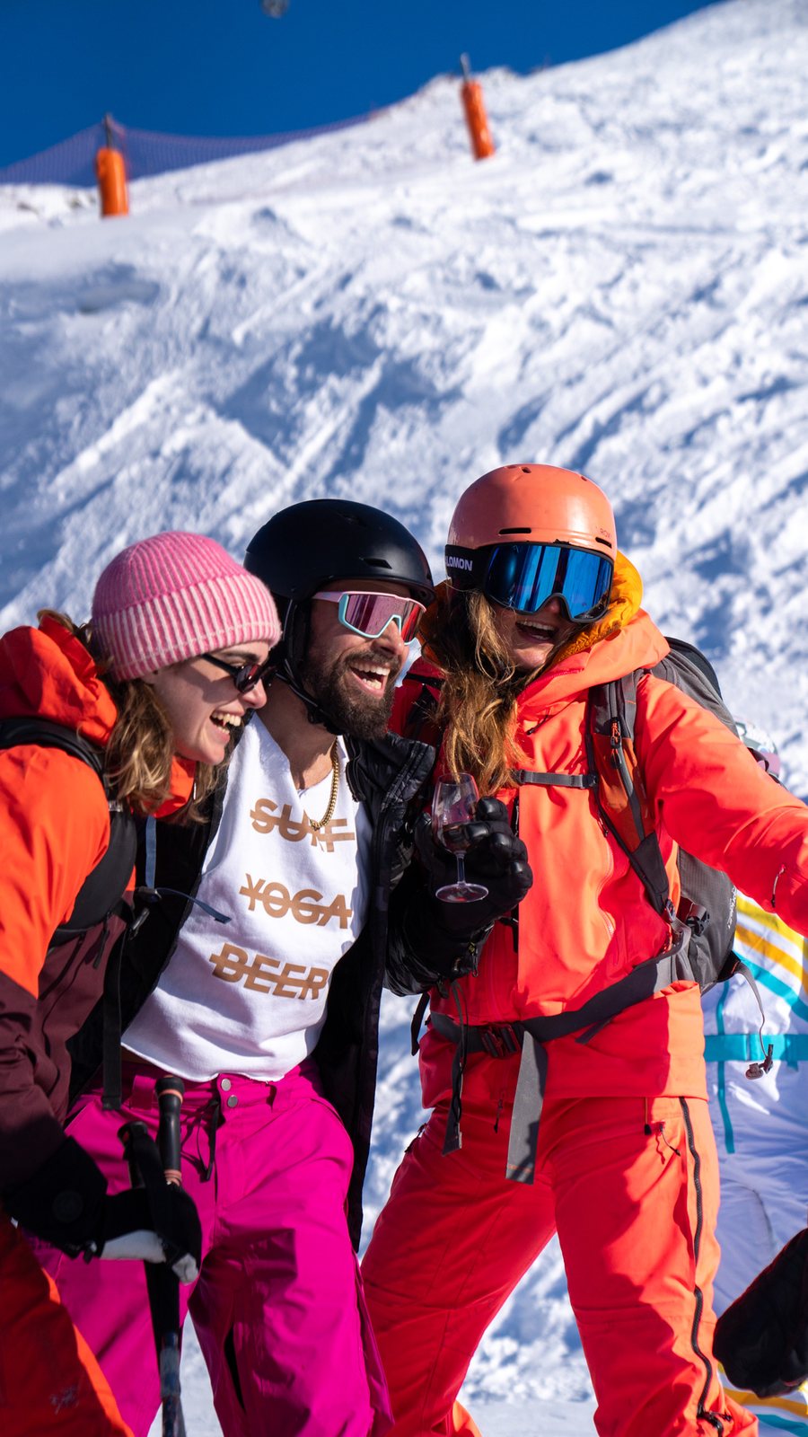 Three friends in ski gear taking a selfie on the slope