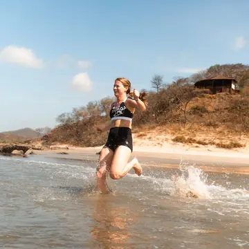 Jumping into a tide pool on the beach on the SYB Nicaragua trip