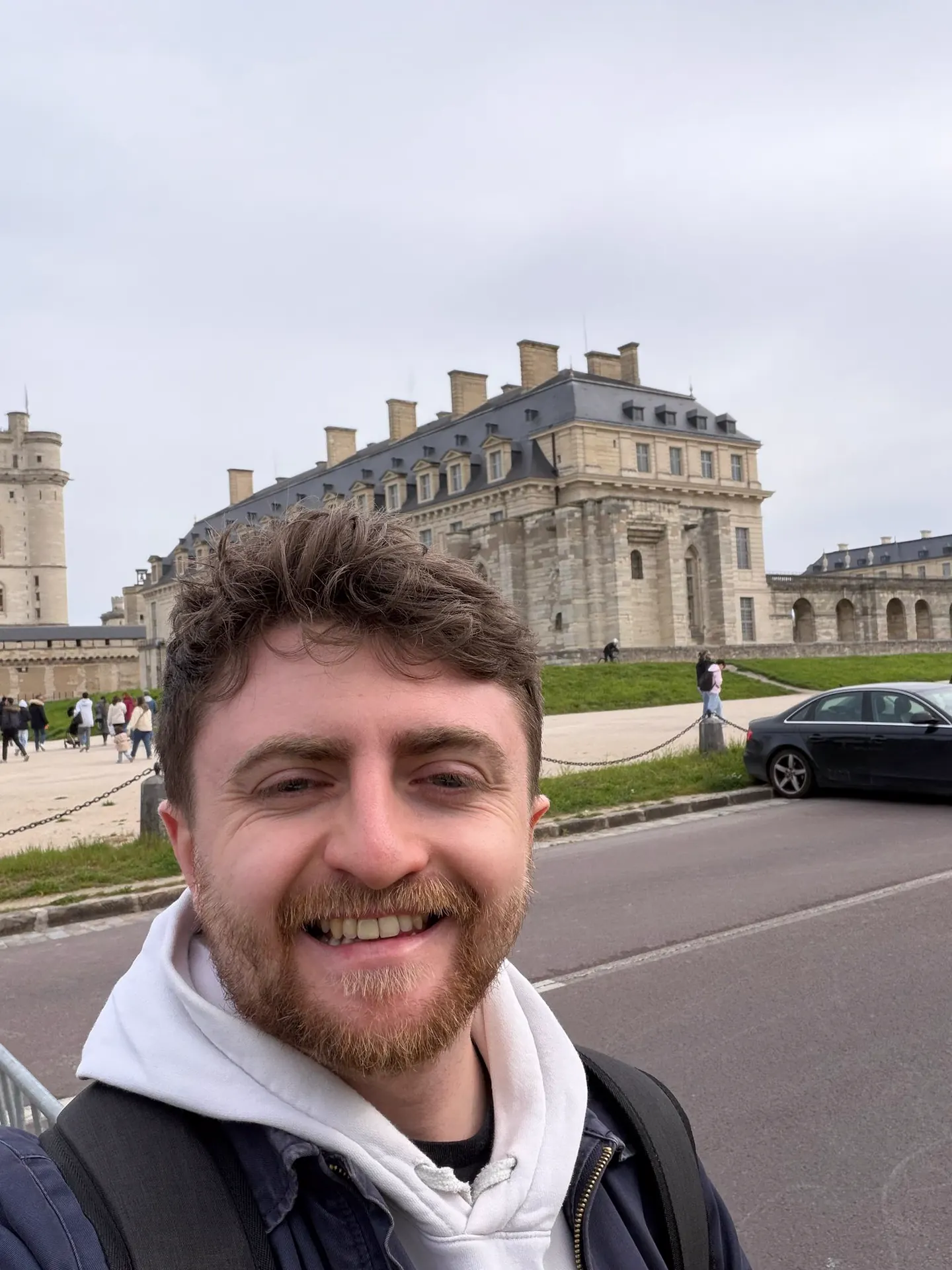 Hardest Adventures participant taking a selfie outside the Chateau de Vincennes on the Paris Marathon trip.