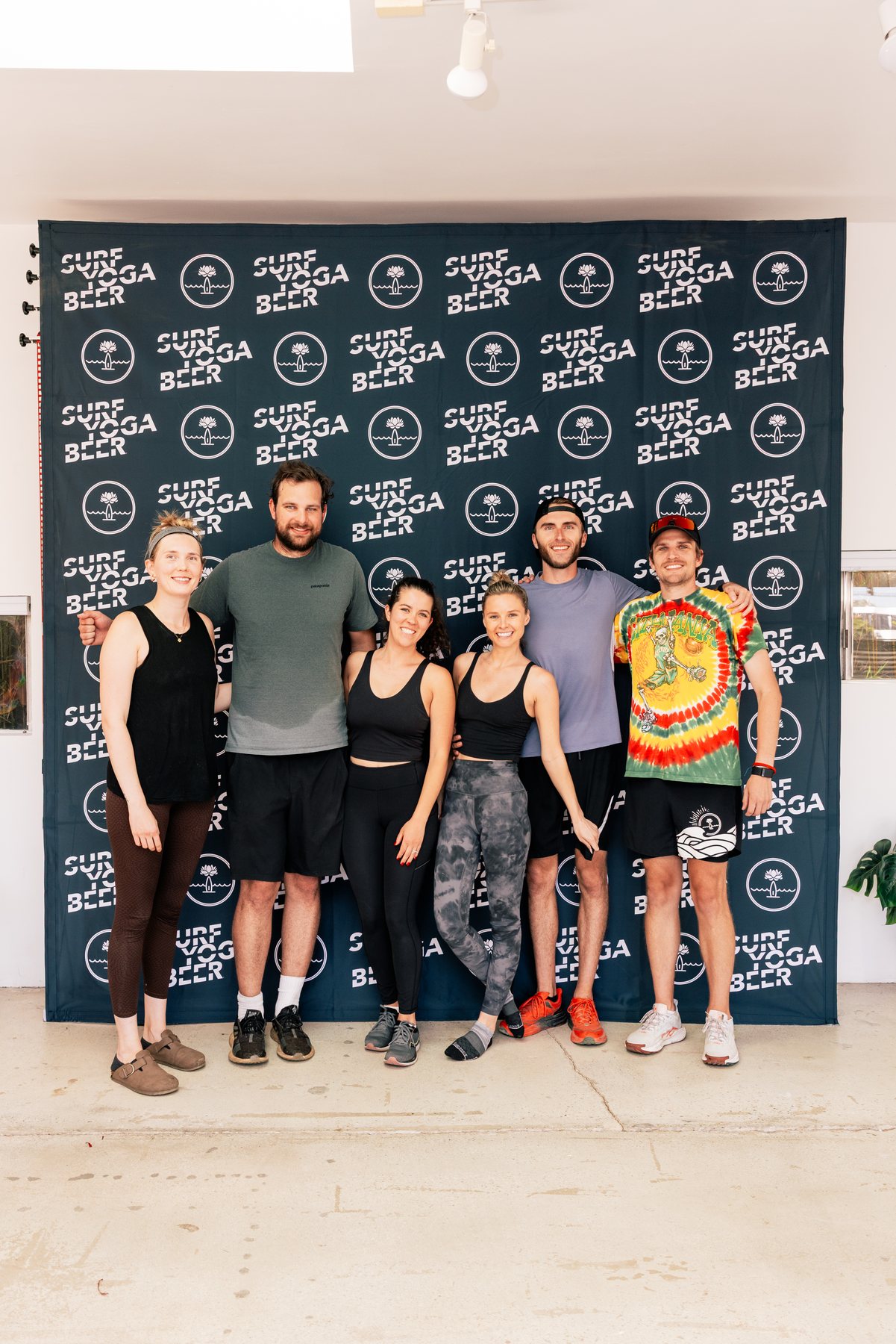 Group photo at the SurfYogaBeer wall