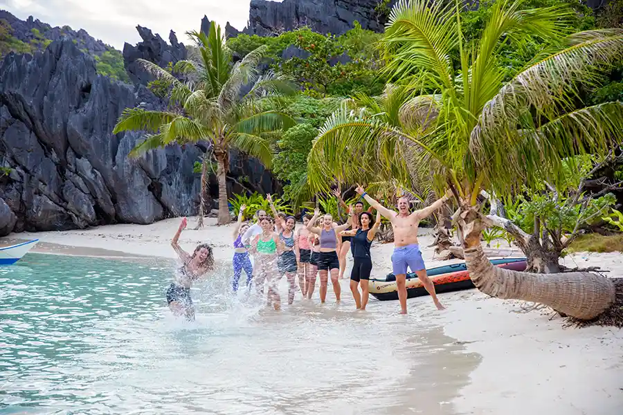 SurfYogaBeer guest snorkelling in clear water in Palawan