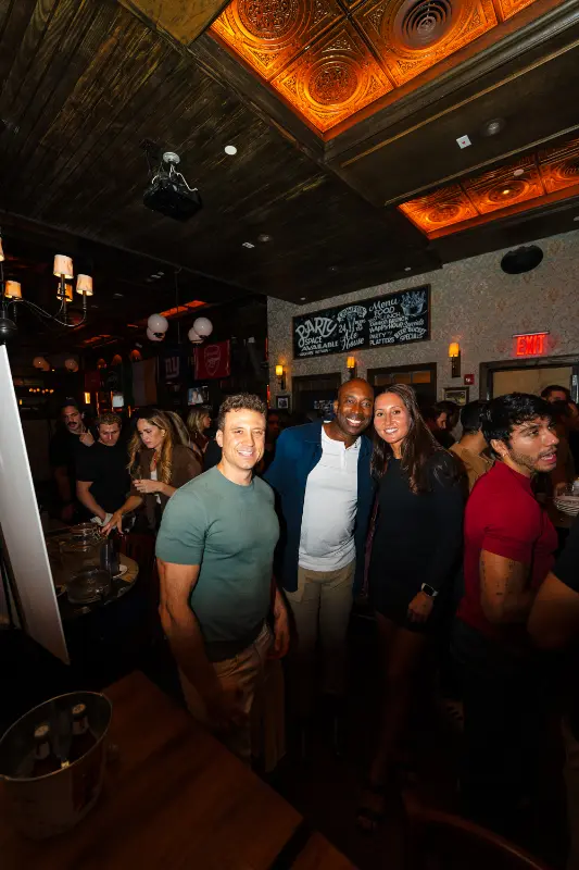 Friends posing in the bar on Friday night