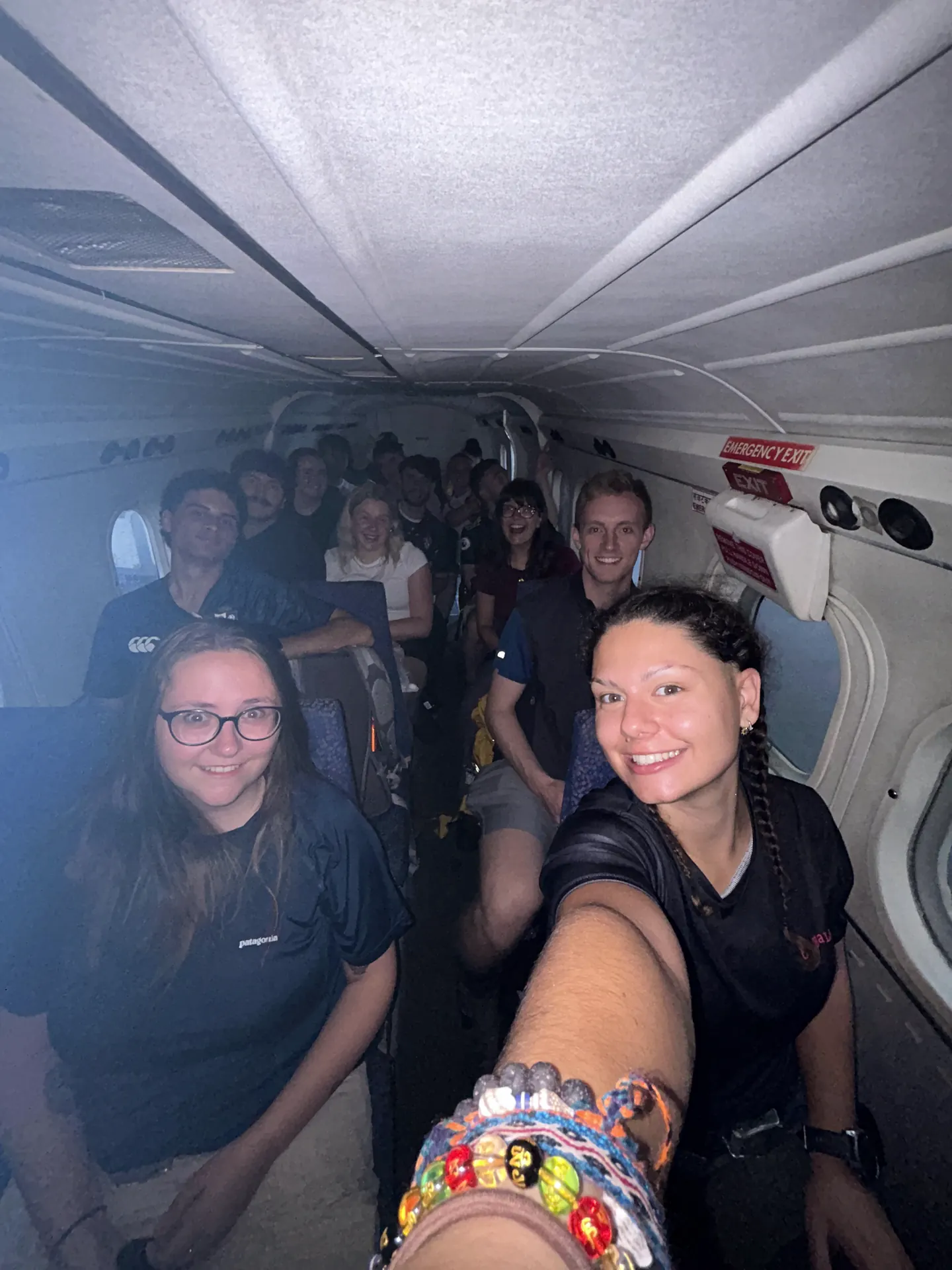 Group selfie on board the mountain flight over the Himalayas at the start of the Everest Base Camp trek with Hardest Adventures.