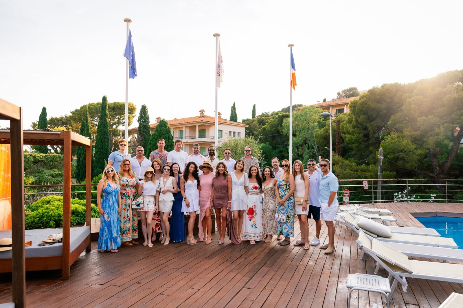 The SurfYogaBeer crew on the pool deck at Hôtel La Rade in Cassis