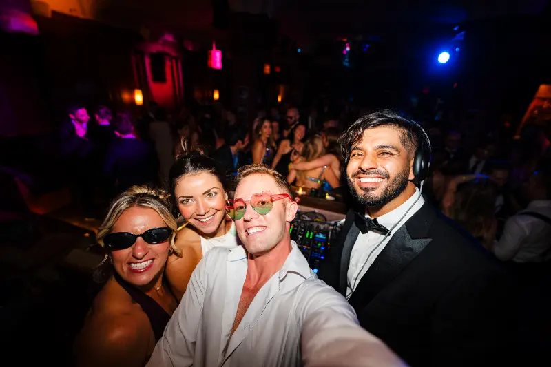 Group selfie in sunglasses and bow ties