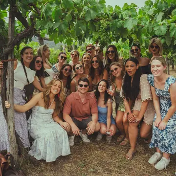The group gathered under the grape vines on the SYB Amalfi Coast trip