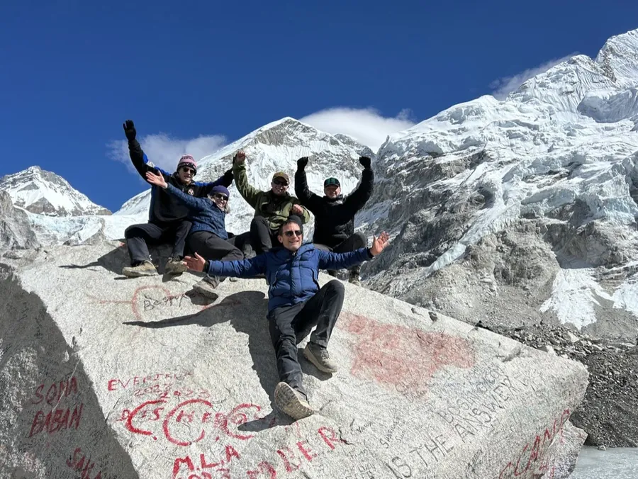 Hardest Adventures group celebrating on arrival at Everest Base Camp in Nepal.