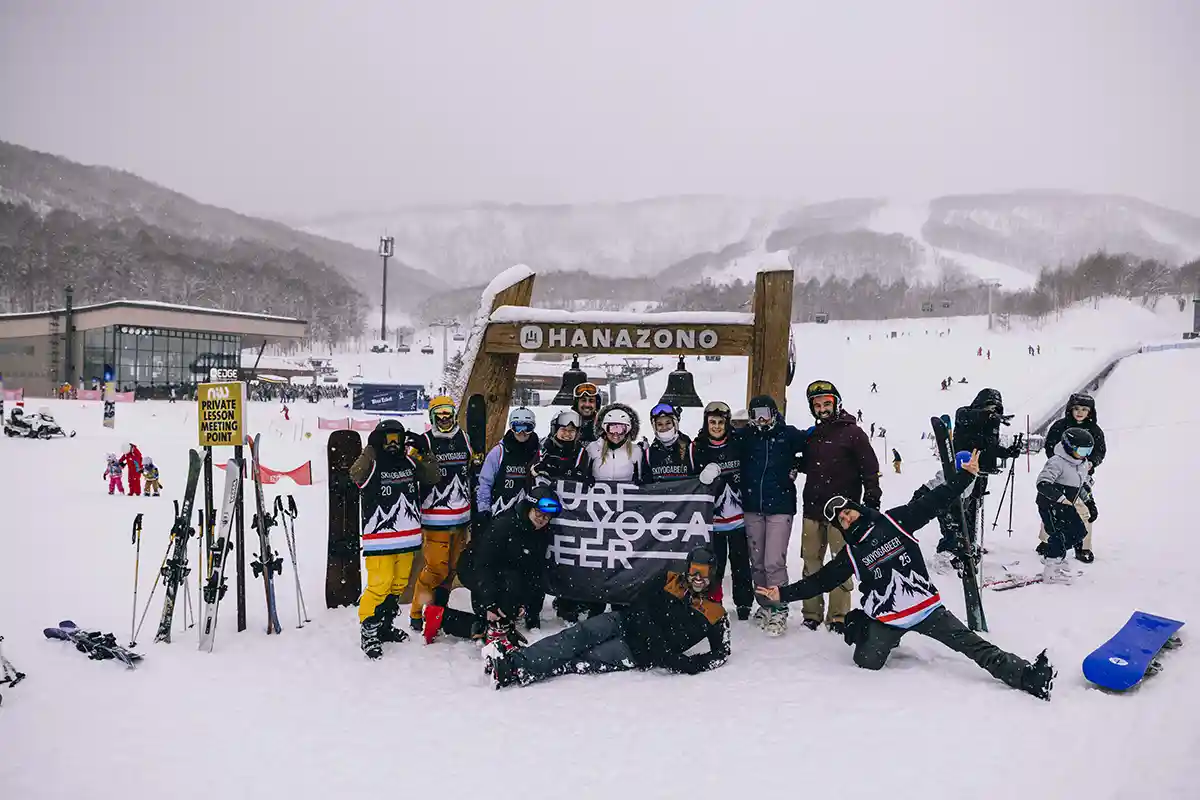 SurfYogaBeer skier in deep powder in the Niseko trees