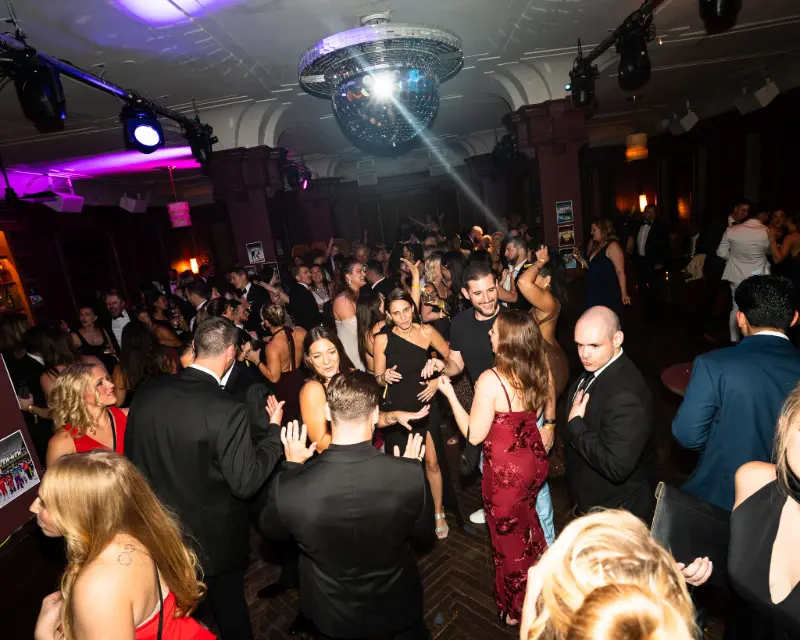 The dance floor under the disco ball at the SYB Black Tie Gala