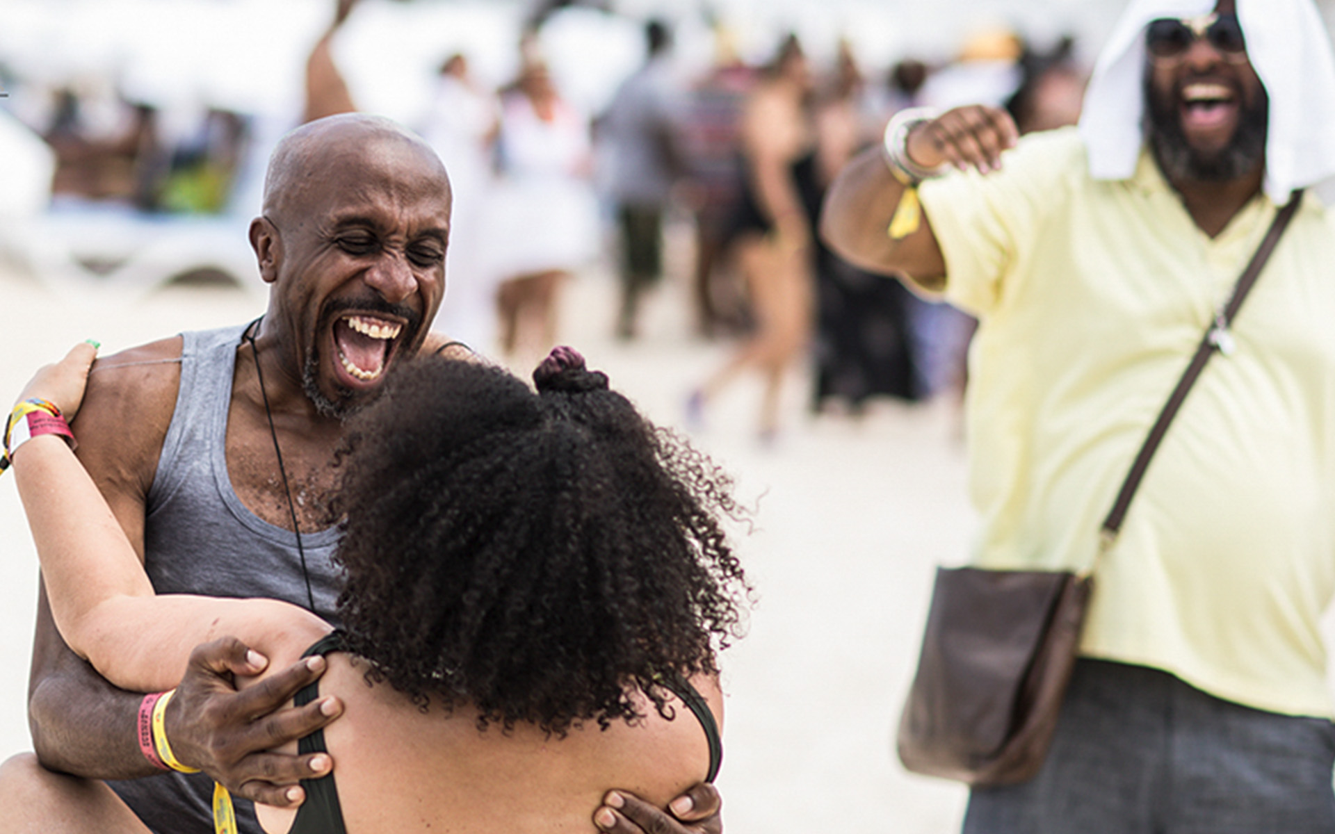 2 people embracing and showing their excitement for reconnecting