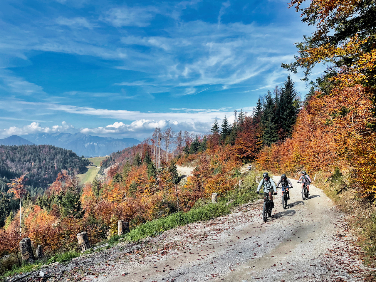 Bikers ascending to the peak of Blegoš, aboive Škofja Loka