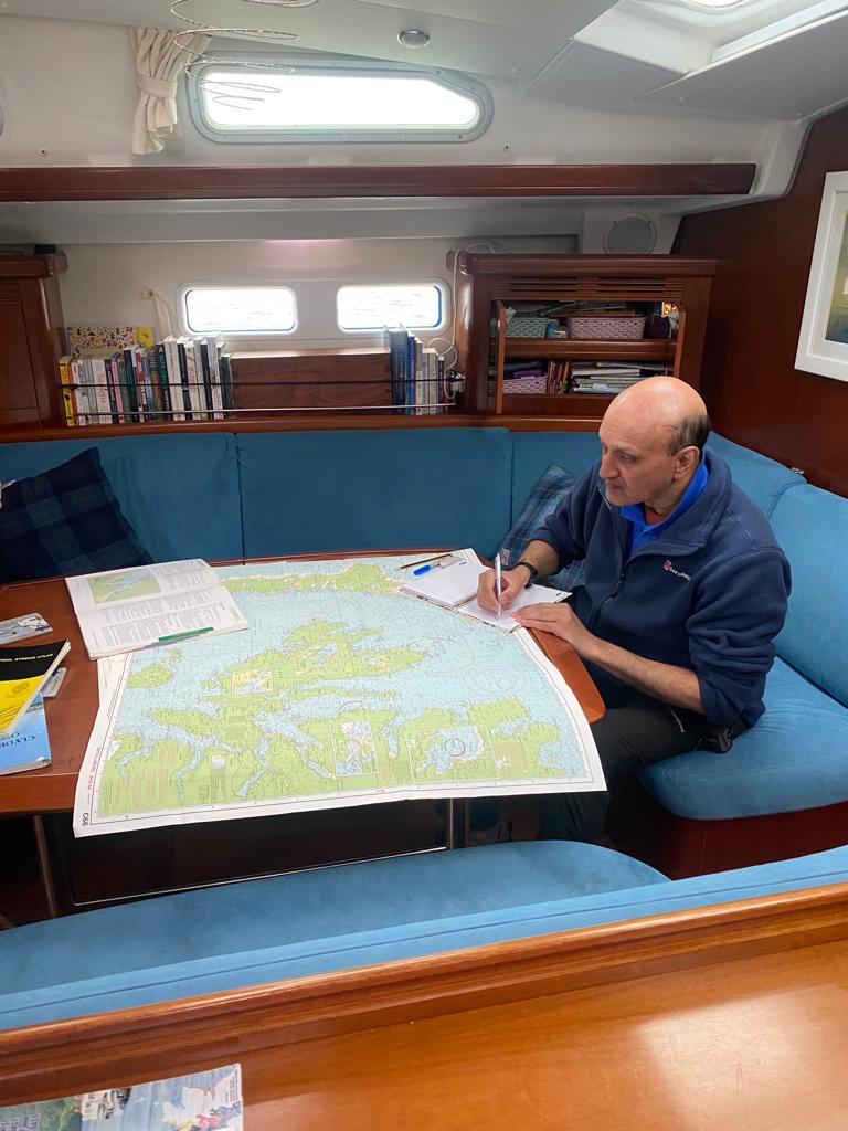 Rohan, sitting in the saloon of "Big Blue", on the Wavysail Scottish adventure sail