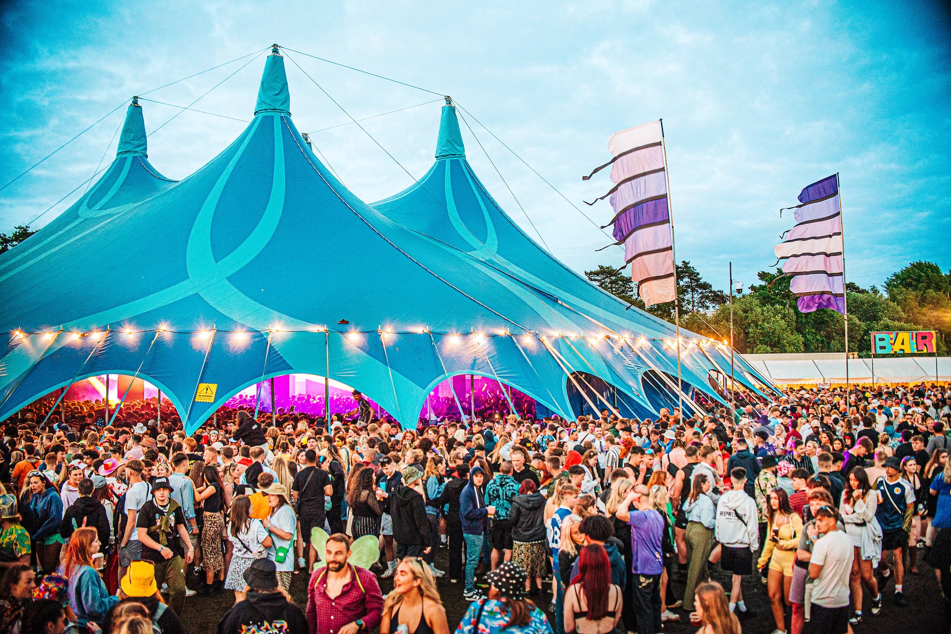 Large crowds gather outside the BigTop tent music arena at Bournemouth 7s Festival, in Dorset.