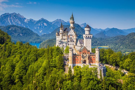Visit the iconic Neuschwanstein castle in the foothills of the Alps 