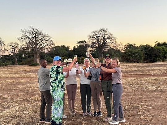 Enjoy a sundowner cocktail in the bush after a game drive