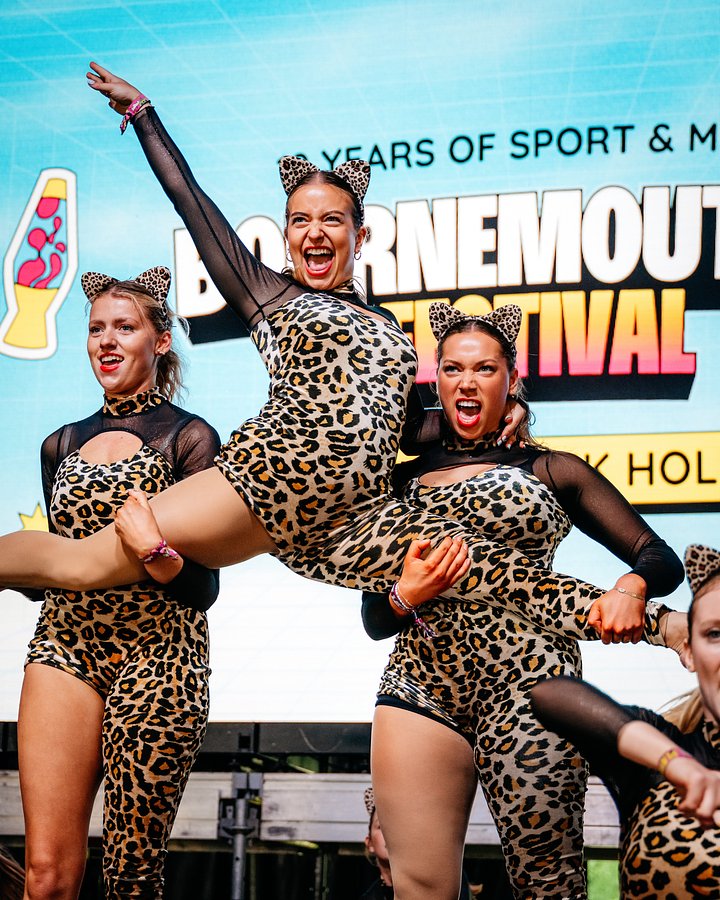 University Dance squad perform routine dressed in leopard print costumes at Bournemouth 7s Festival, dance competition.