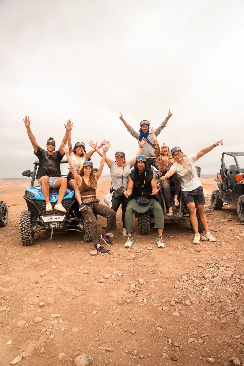 An SYB group cheering on ATVs in the desert