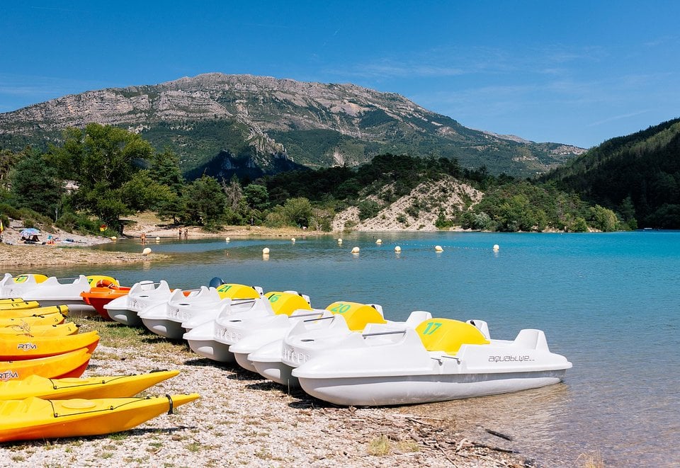 Pedal boats on the turquoise water of Lac de Castillon