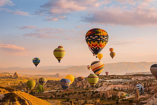 Drift over the world-famous fairy-chimneys of Cappadocia in a hot-air balloon