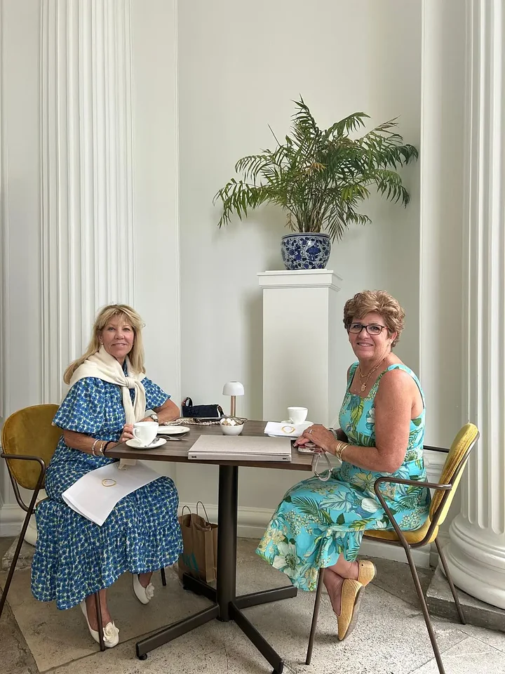 twoladiessittingwithtea
