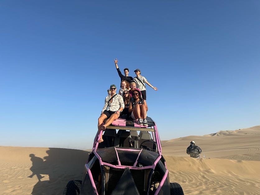 The group on top of a dune buggy in the Huacachina desert