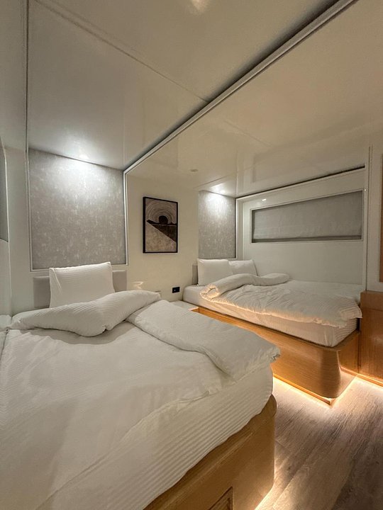 A bed at Cabin  3 (1nd Deck Twin - En Suite)