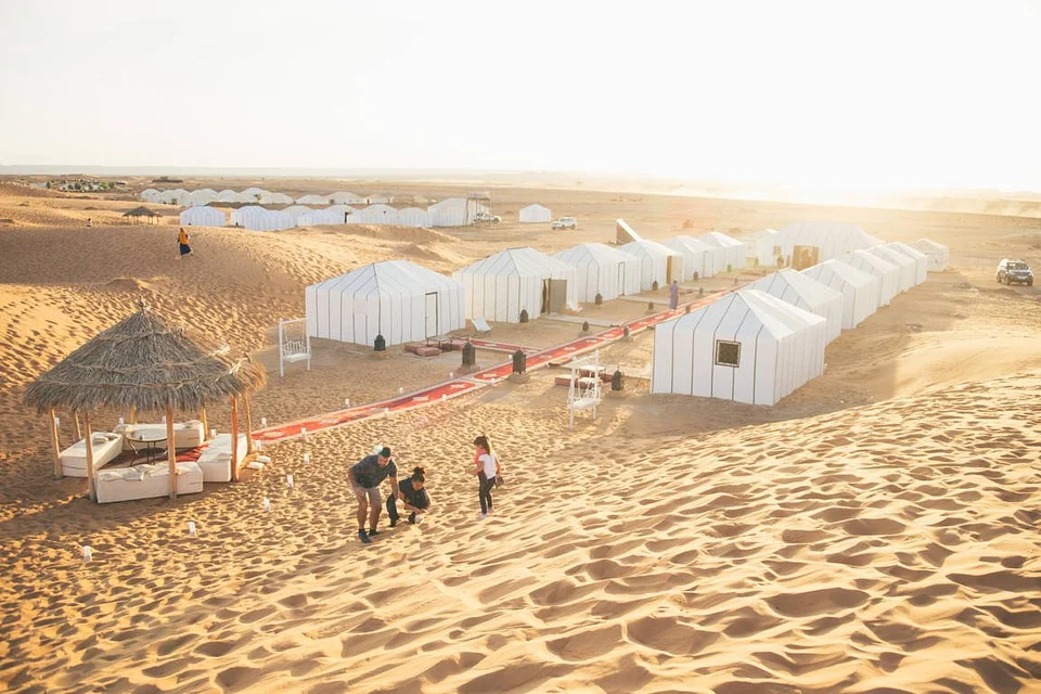 White tents at the desert camp in the dunes