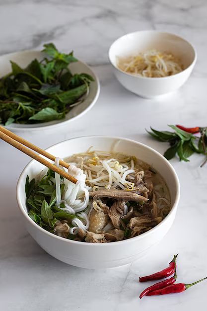 verticalshotsoupphobowithsticksitvietnamesefoodvietnamesecuisine_18162431884