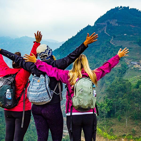 Three female travellers backpacking through Sa Pa Vietnam